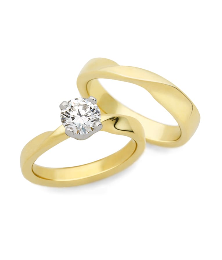 Mobius Twist engagement ring and wedding band Mobius Twist from The Brown Goldsmiths Signature Ring Collection
